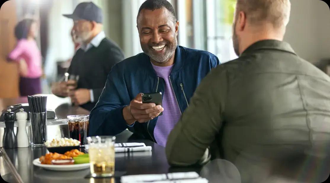 Man smiling with cell phone